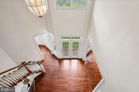 a view of wooden floor and windows in a room