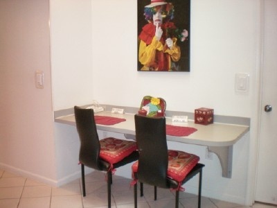 9998 Seacrest Circle, Unit B Boynton Beach, FL 33437 - Photo 13 of 23 a table with chairs and a table in it