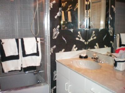 9998 Seacrest Circle, Unit B Boynton Beach, FL 33437 - Photo 23 of 23 a bathroom with a sink and a mirror