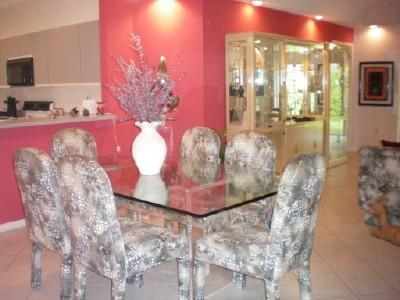 9998 Seacrest Circle, Unit B Boynton Beach, FL 33437 - Photo 3 of 23 a vase of flowers sitting on a table