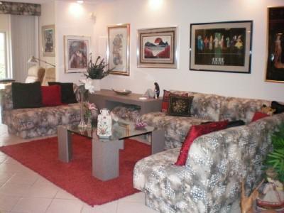 9998 Seacrest Circle, Unit B Boynton Beach, FL 33437 - Photo 5 of 23 a living room with furniture and painting on the wall