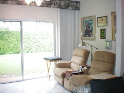 9998 Seacrest Circle, Unit B Boynton Beach, FL 33437 - Photo 6 of 23 a living room with furniture and a window