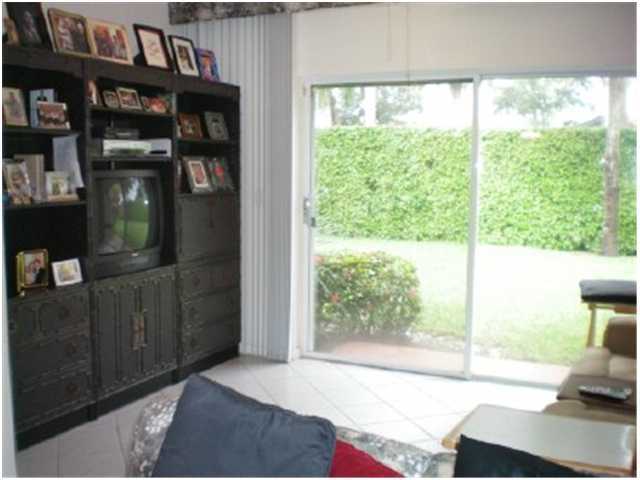 9998 Seacrest Circle, Unit B Boynton Beach, FL 33437 - Photo 7 of 23 a view of a living room and a window
