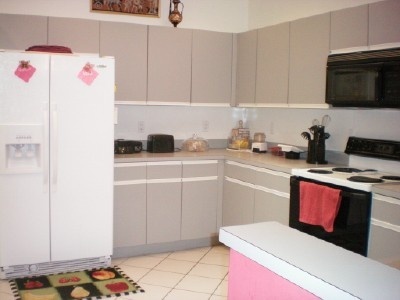9998 Seacrest Circle, Unit B Boynton Beach, FL 33437 - Photo 10 of 23 a kitchen with a sink and a stove top oven
