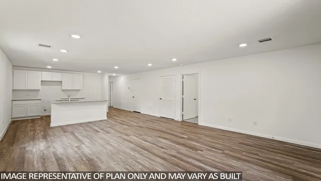 a view of kitchen with wooden floor
