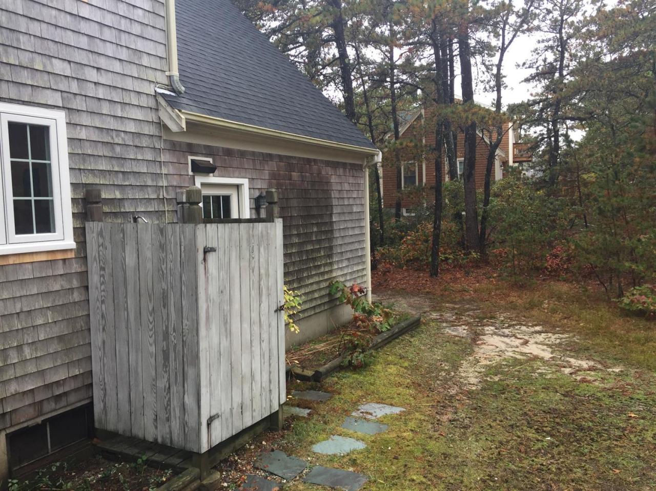 17 Wintergreen Road Mashpee, MA 02649 - Photo 28 of 34 a view of a house with a yard