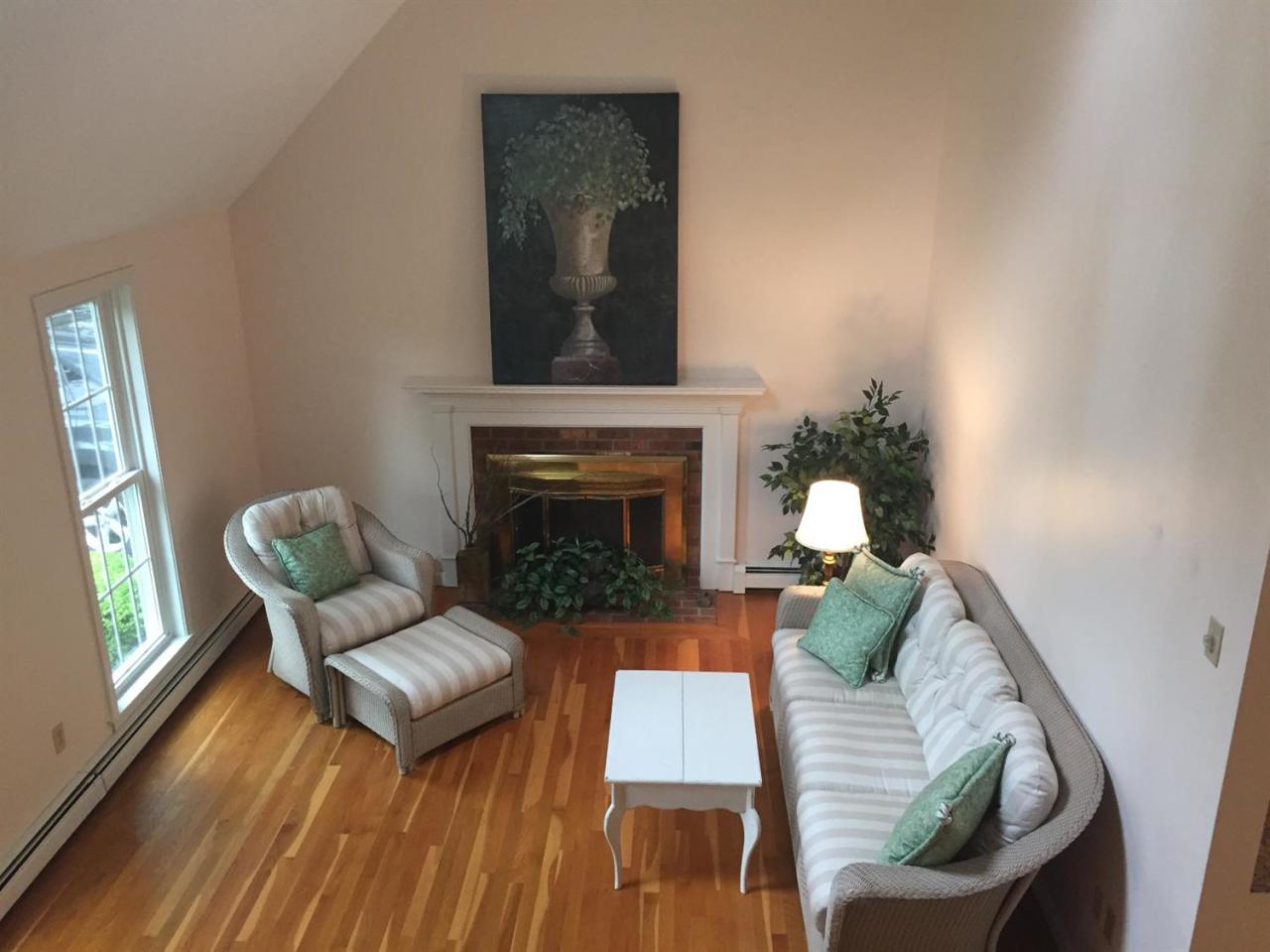 17 Wintergreen Road Mashpee, MA 02649 - Photo 5 of 34 a living room with furniture and a fireplace