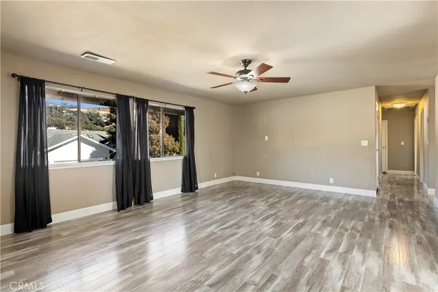 a kitchen with granite countertop a sink a stove and cabinets