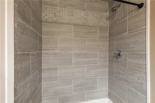 a view of a balcony with wooden floor and city view