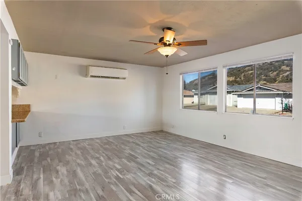a kitchen with a stove top oven sink and cabinets