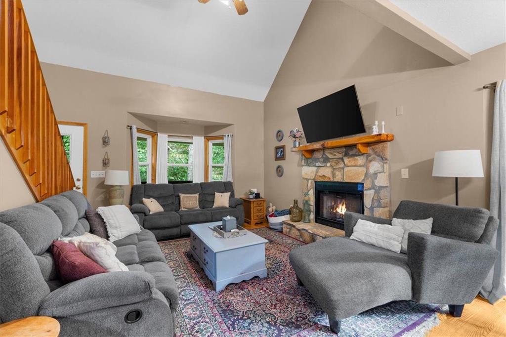697 Zeppelin Strasse Helen, GA 30545 - Photo 13 of 41 a living room with furniture a fireplace and a flat screen tv