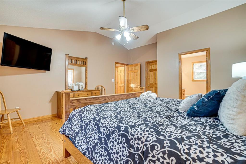 697 Zeppelin Strasse Helen, GA 30545 - Photo 17 of 41 a bedroom with a bed and a flat screen tv