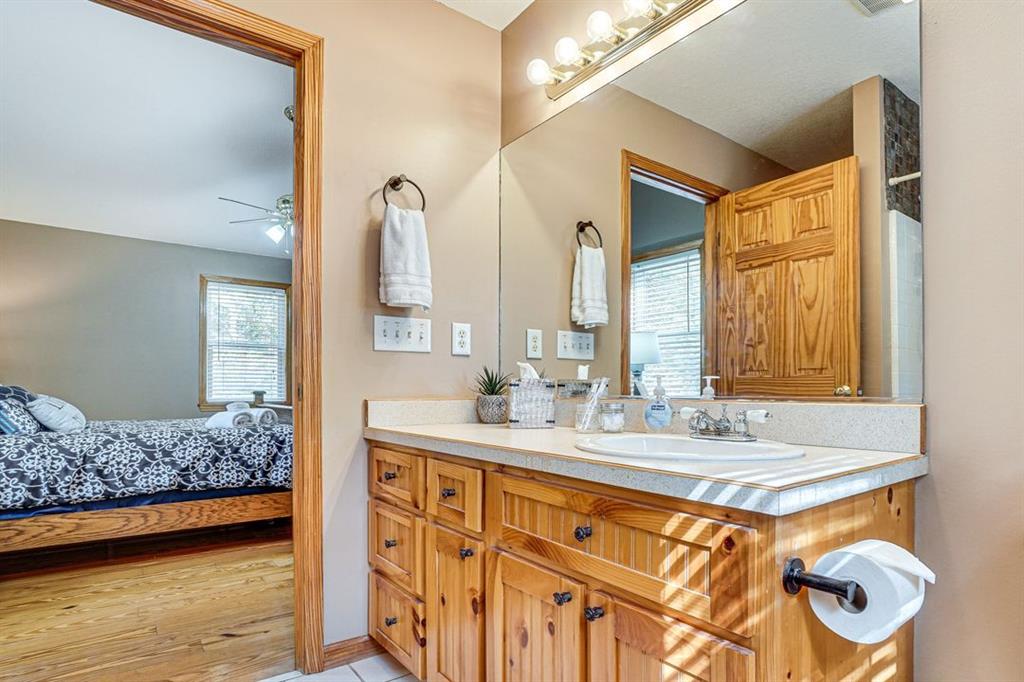 697 Zeppelin Strasse Helen, GA 30545 - Photo 18 of 41 a bathroom with a sink double vanity and a mirror