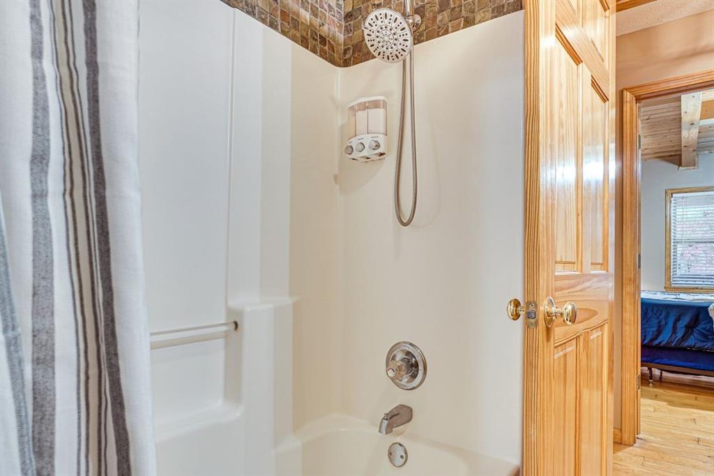 697 Zeppelin Strasse Helen, GA 30545 - Photo 19 of 41 a bathroom with a glass door shower