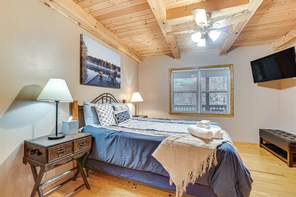 697 Zeppelin Strasse Helen, GA 30545 - Photo 20 of 41 a bed room with a bed window and a chair