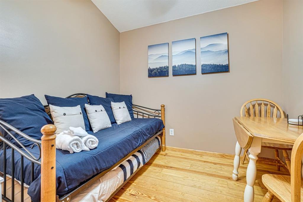 697 Zeppelin Strasse Helen, GA 30545 - Photo 25 of 41 a bed sitting in a bedroom next to a window