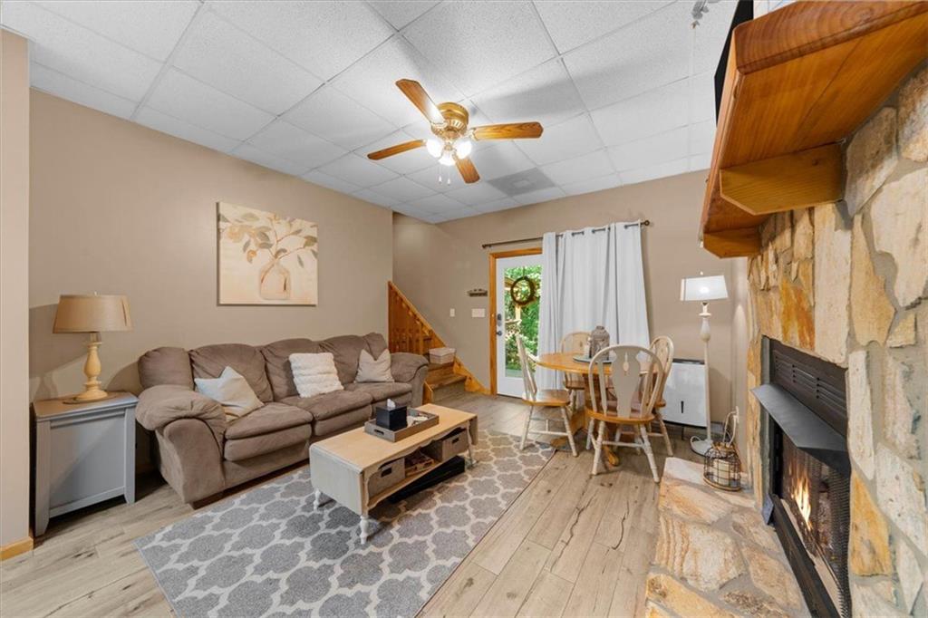 697 Zeppelin Strasse Helen, GA 30545 - Photo 28 of 41 a living room with furniture a fireplace and a flat screen tv