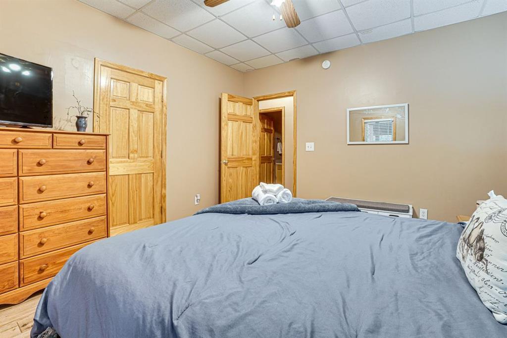 697 Zeppelin Strasse Helen, GA 30545 - Photo 32 of 41 a bedroom with a bed and flat screen tv