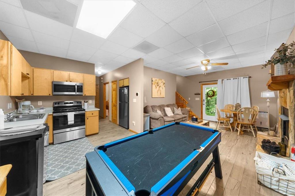 697 Zeppelin Strasse Helen, GA 30545 - Photo 34 of 41 a living room with stainless steel appliances kitchen island furniture and a view of kitchen