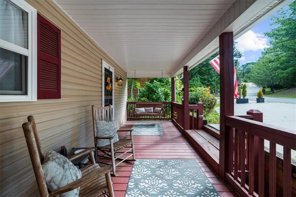 697 Zeppelin Strasse Helen, GA 30545 - Photo 7 of 41 a porch with wooden floor outdoor seating and yard