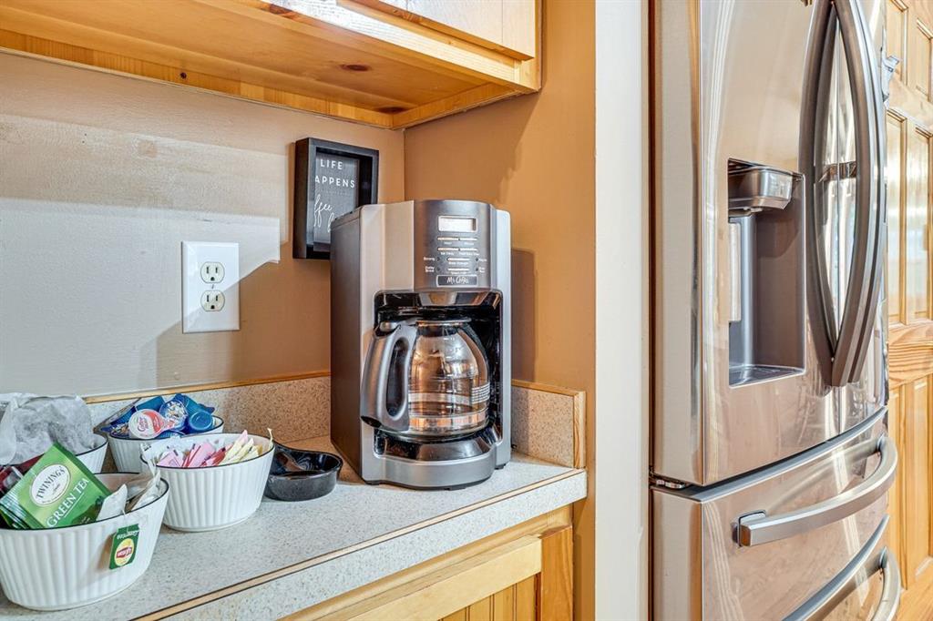 697 Zeppelin Strasse Helen, GA 30545 - Photo 10 of 41 a kitchen with a refrigerator and cabinets