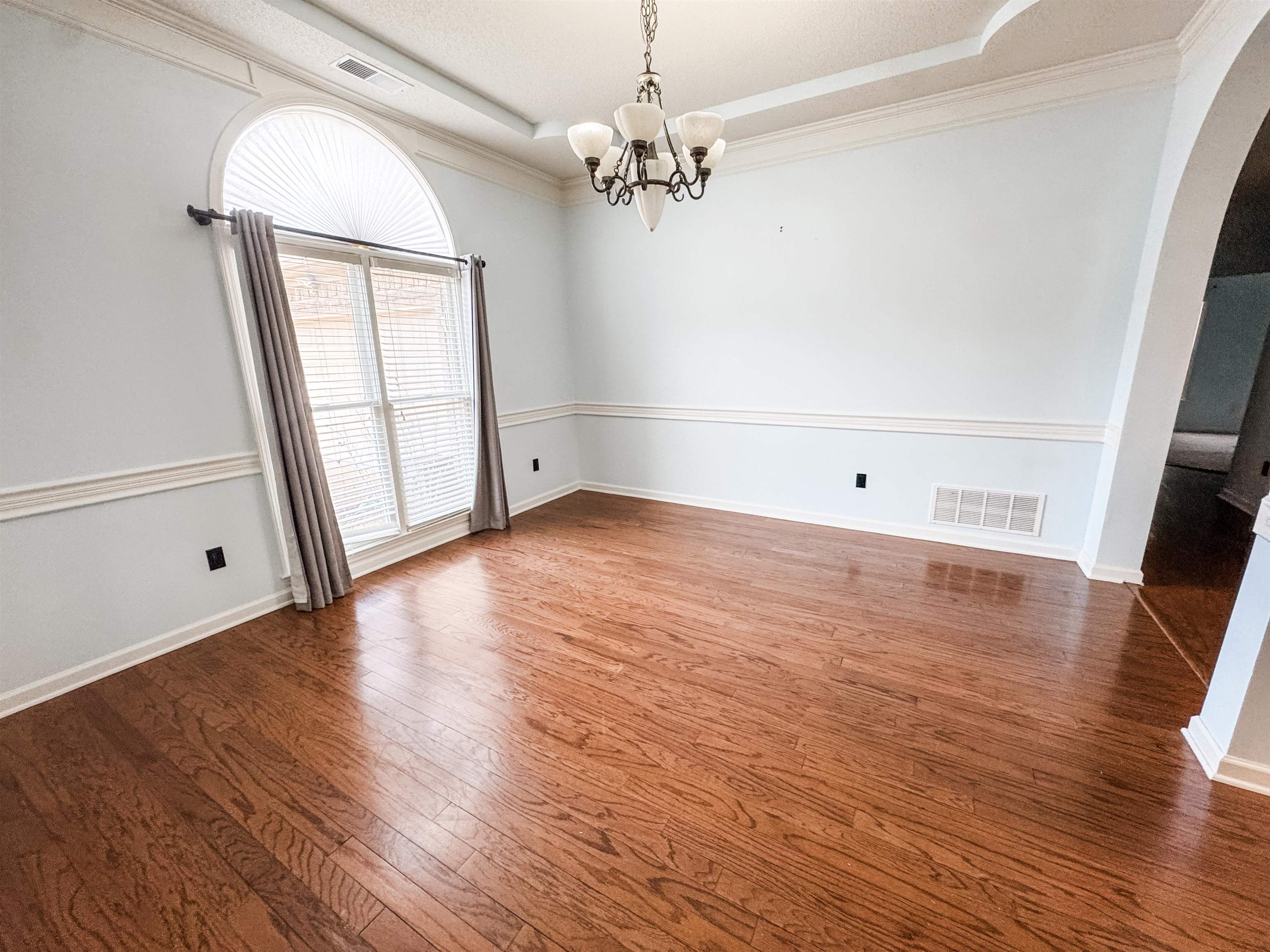 10521 Red Stone Drive Collierville, TN 38017 - Photo 2 of 15 an empty room with wooden floor and windows