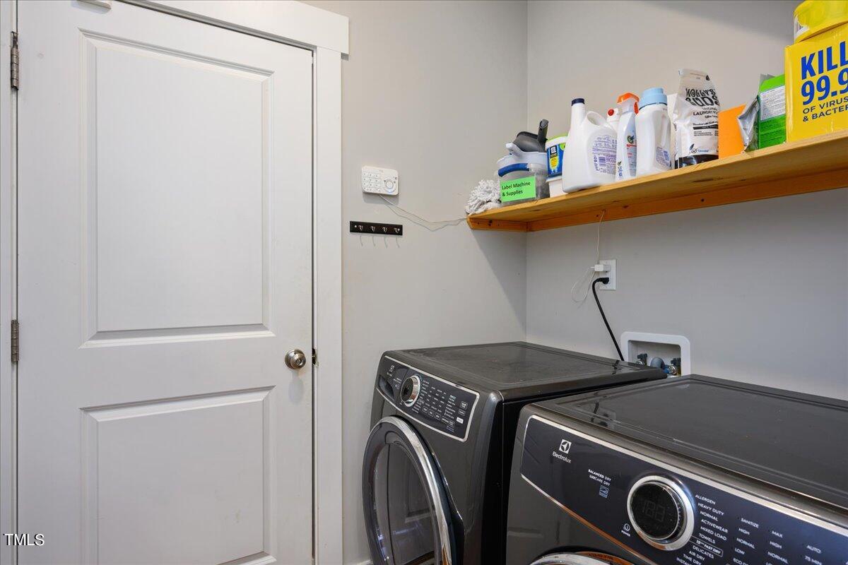 1415 Pine Ridge Road Spring Hope, NC 27882 - Photo 11 of 25 a utility room with dryer and washer
