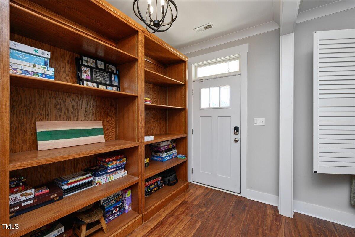 1415 Pine Ridge Road Spring Hope, NC 27882 - Photo 3 of 25 a room with furniture and wooden floor