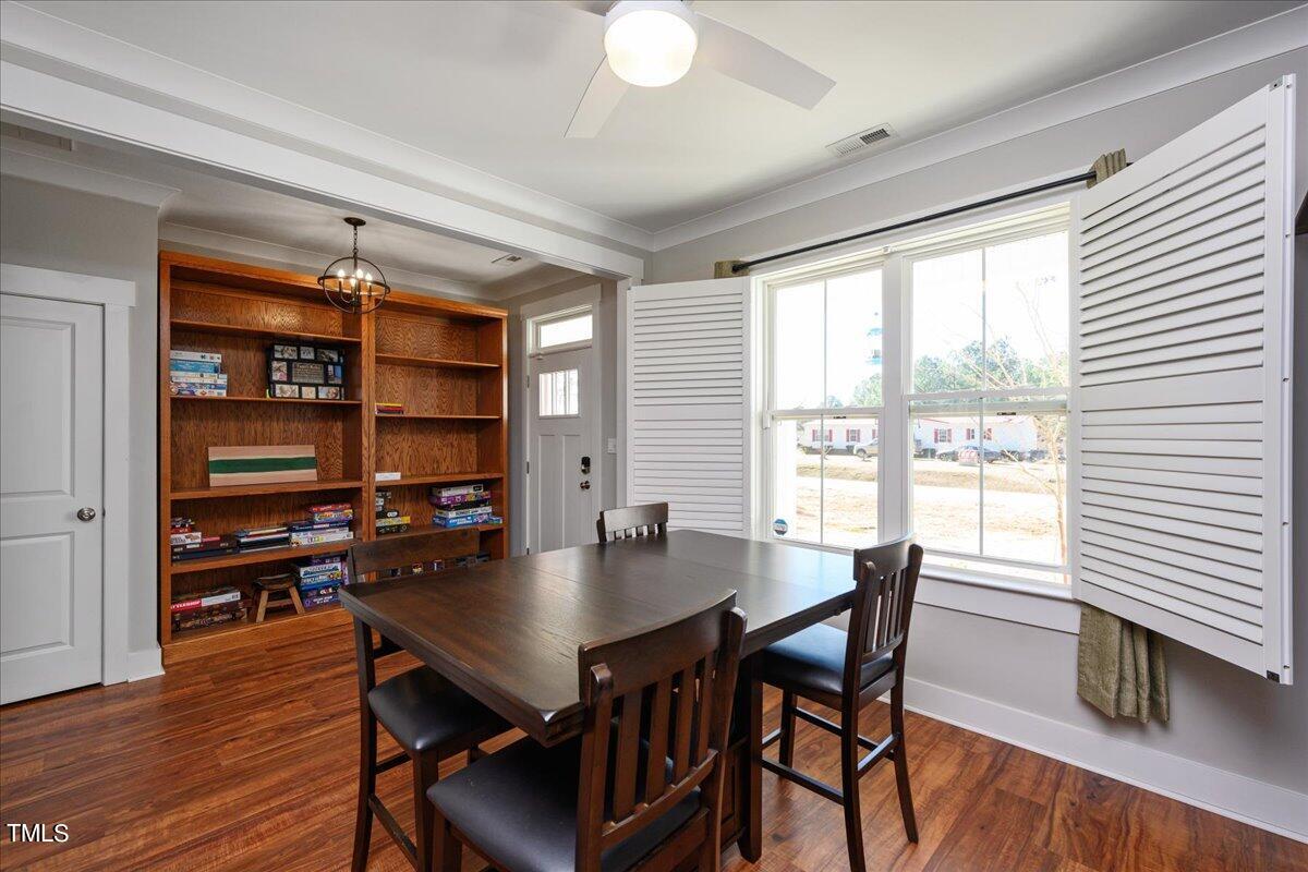 1415 Pine Ridge Road Spring Hope, NC 27882 - Photo 4 of 25 a view of a dining room with furniture and wooden floor