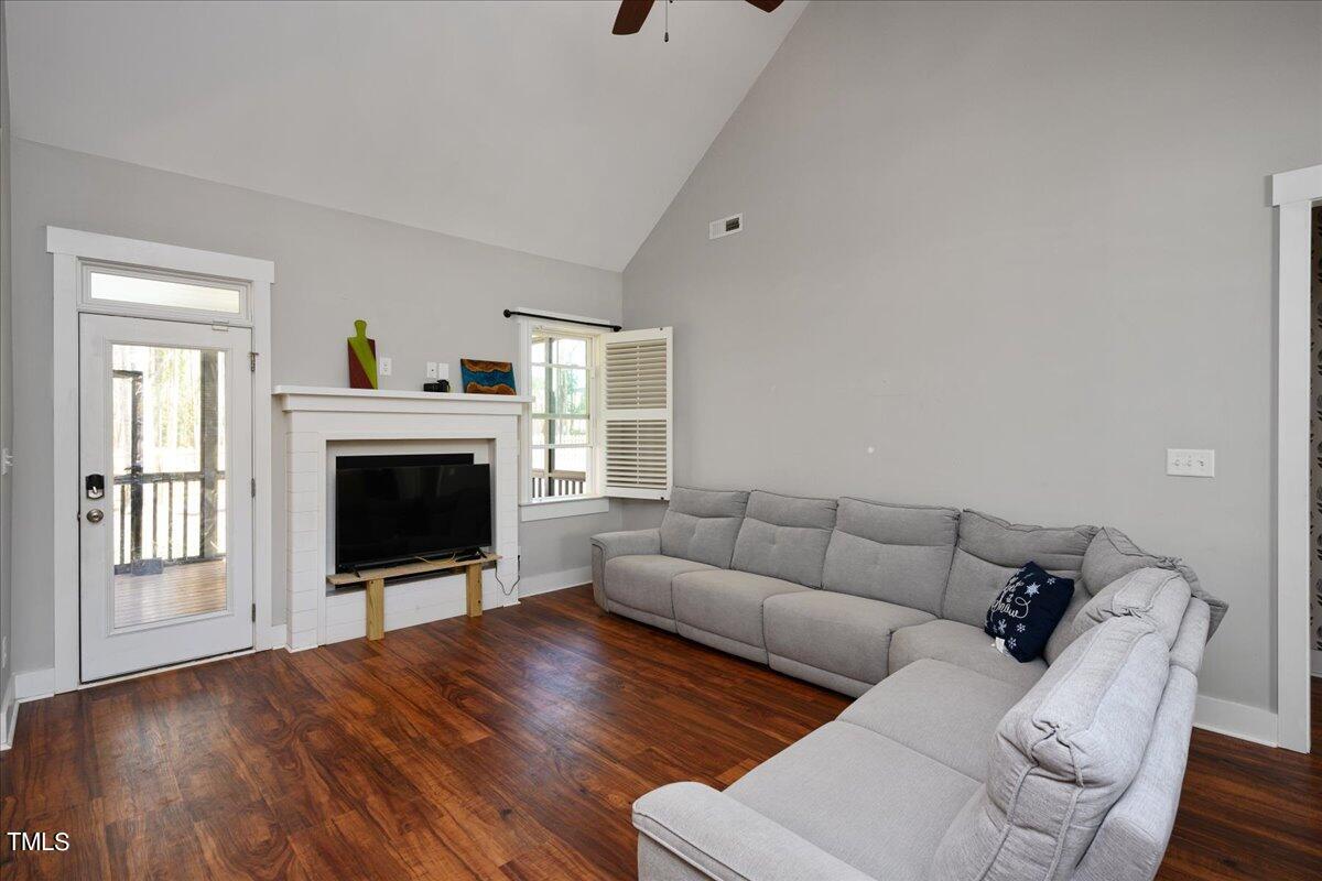 1415 Pine Ridge Road Spring Hope, NC 27882 - Photo 5 of 25 a living room with furniture and a fireplace