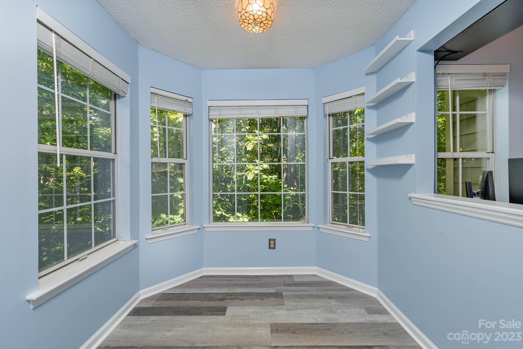 6523 Clavell Lane, Unit E Charlotte, NC 28210 - Photo 10 of 24 a view of an empty room with a window and balcony