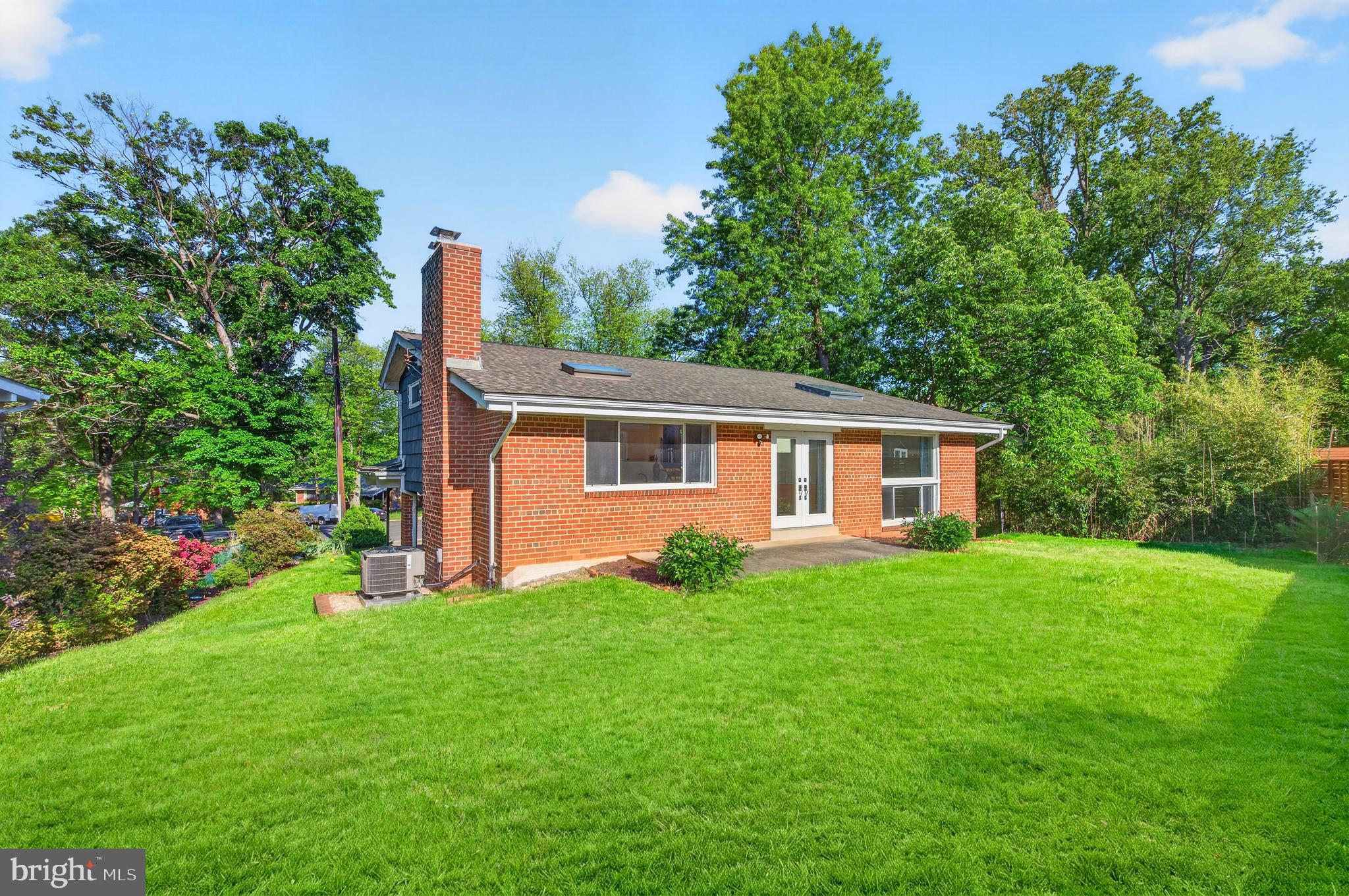 914 Kenbrook Court Silver Spring, MD 20902 - Photo 32 of 35 a front view of a house with garden