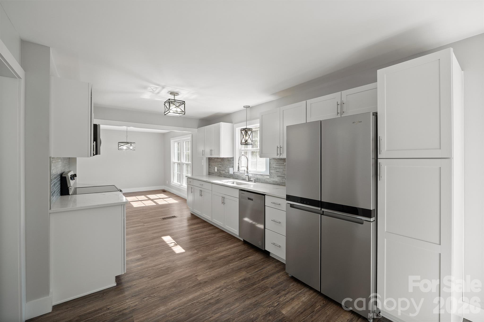 306 7th St Place Northeast Conover, NC 28613 - Photo 19 of 47 a kitchen with a refrigerator and a sink