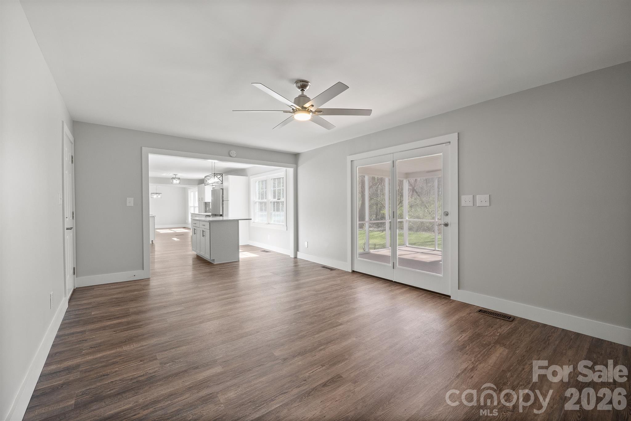 306 7th St Place Northeast Conover, NC 28613 - Photo 25 of 47 a view of an empty room with a window and wooden floor