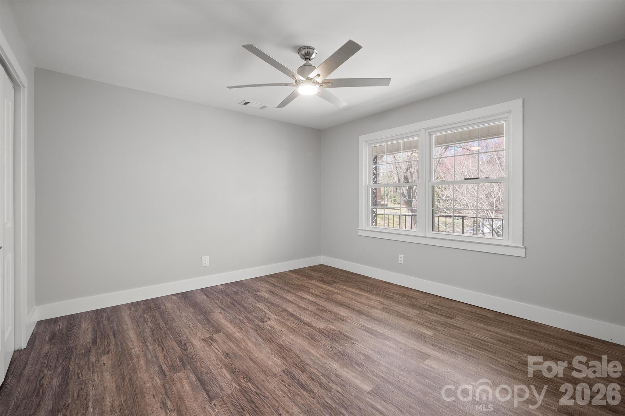 306 7th St Place Northeast Conover, NC 28613 - Photo 36 of 47 wooden floor in an empty room with a window