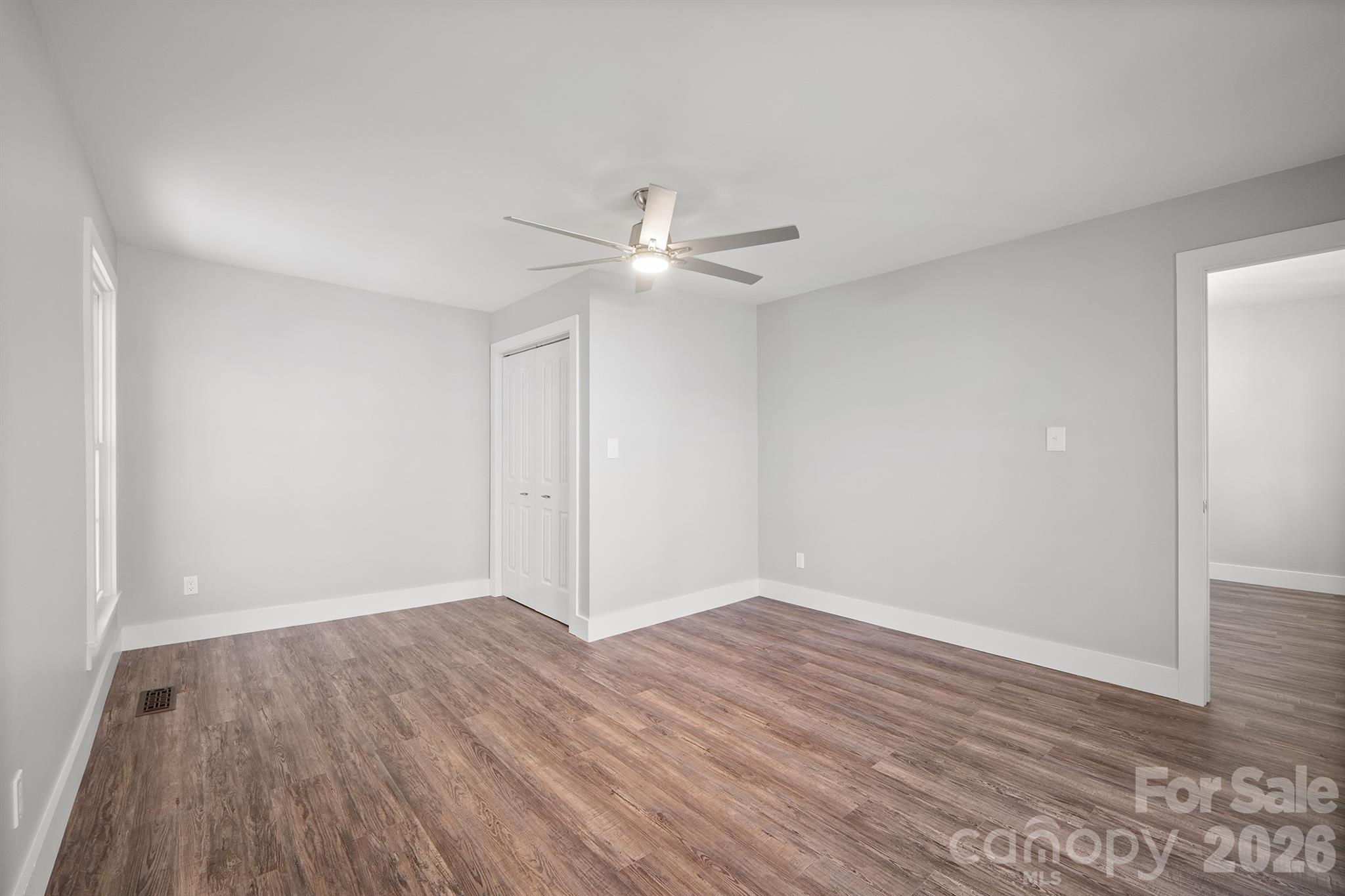 306 7th St Place Northeast Conover, NC 28613 - Photo 9 of 47 a view of an empty room with wooden floor
