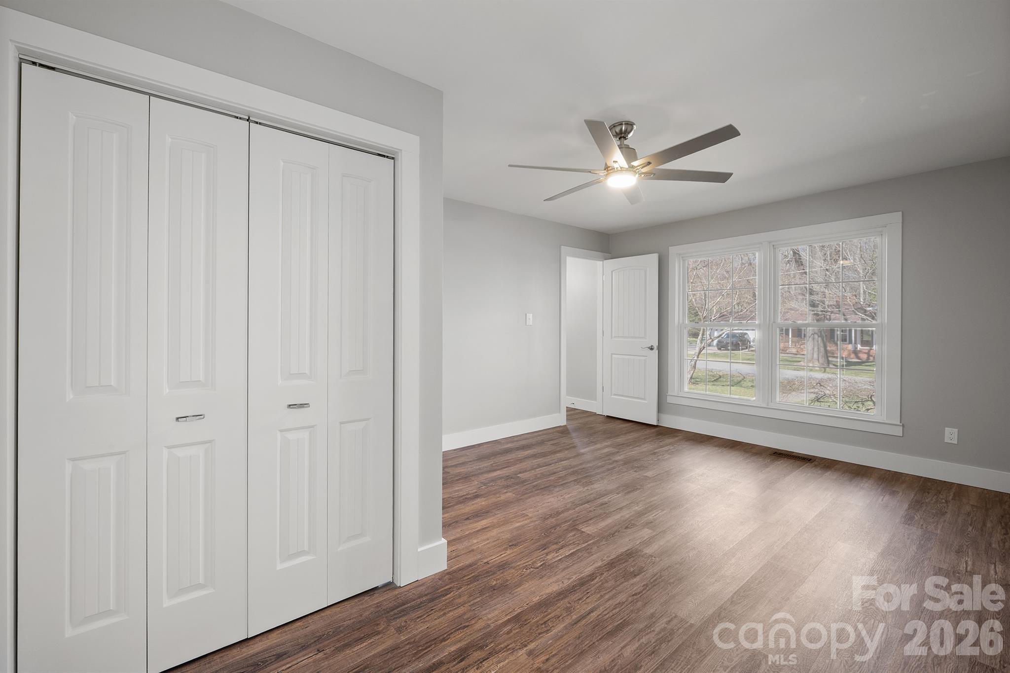 306 7th St Place Northeast Conover, NC 28613 - Photo 10 of 47 a view of an empty room with wooden floor and a window