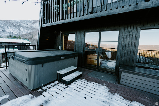 1413 Basel Drive Midway, UT 84049 - Photo 101 of 137 Snow covered deck featuring a mountain view and a hot tub