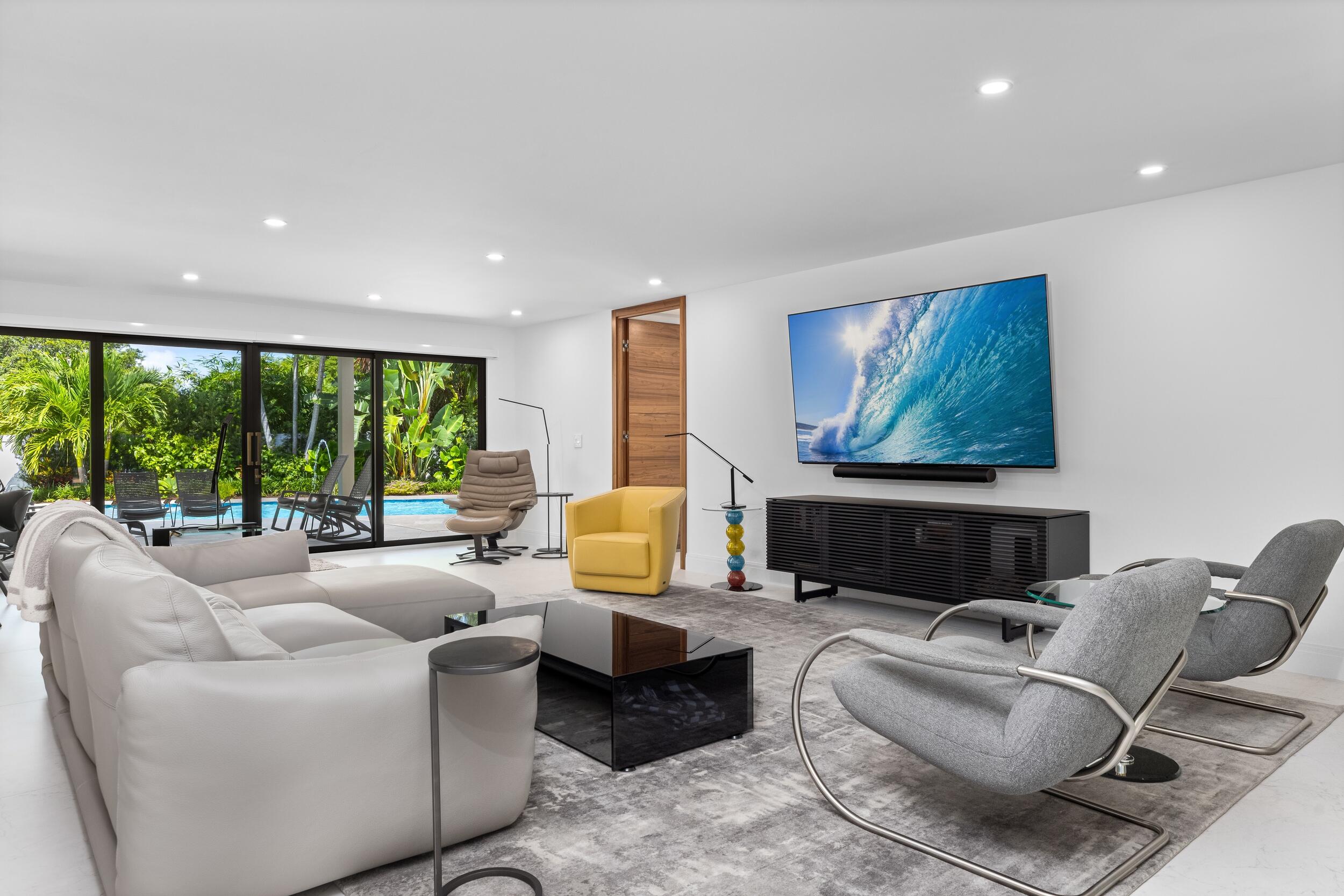 843 Northeast Mulberry Drive Boca Raton, FL 33487 - Photo 11 of 57 a living room with furniture and a large window