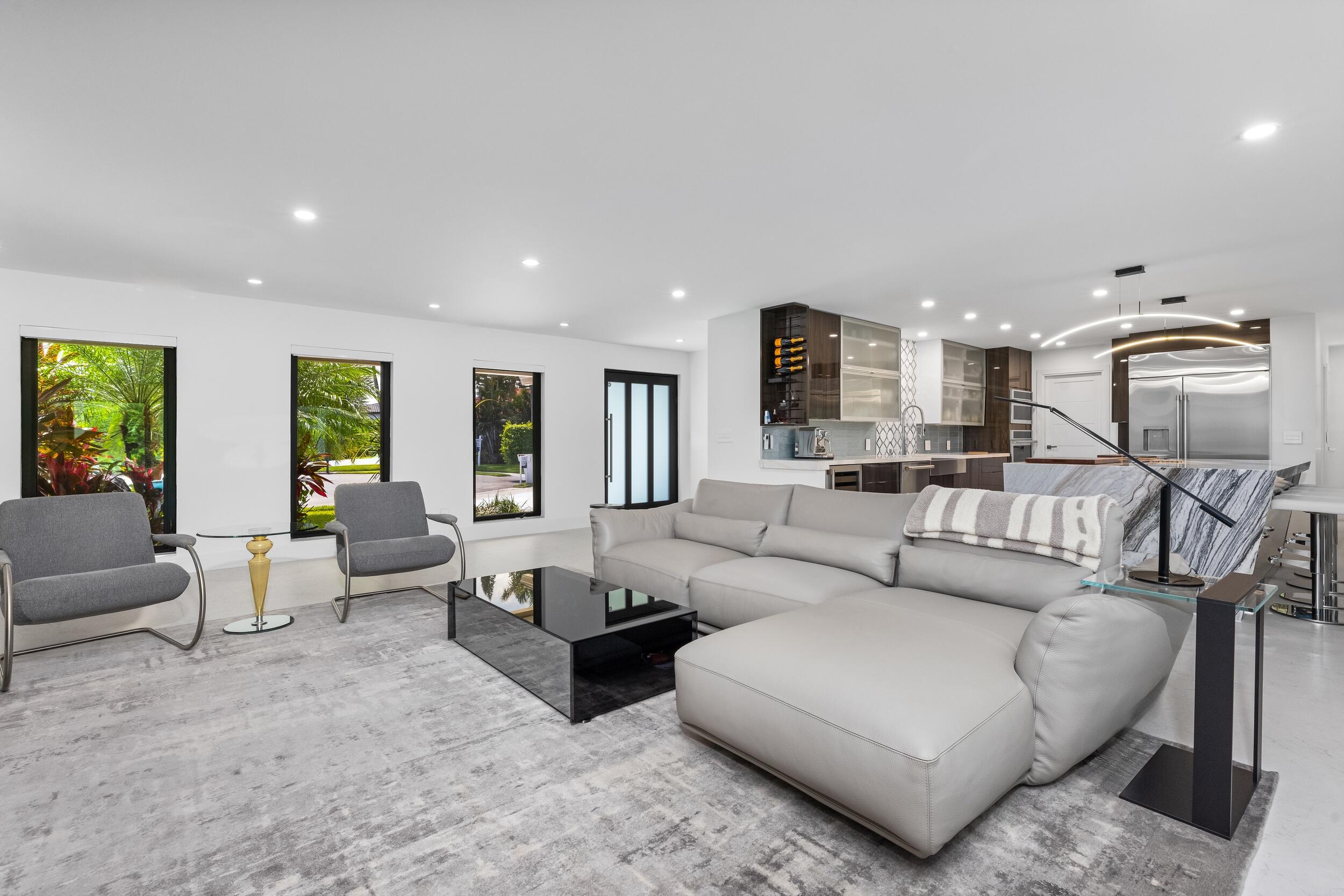 843 Northeast Mulberry Drive Boca Raton, FL 33487 - Photo 12 of 57 a living room with furniture and a view of kitchen