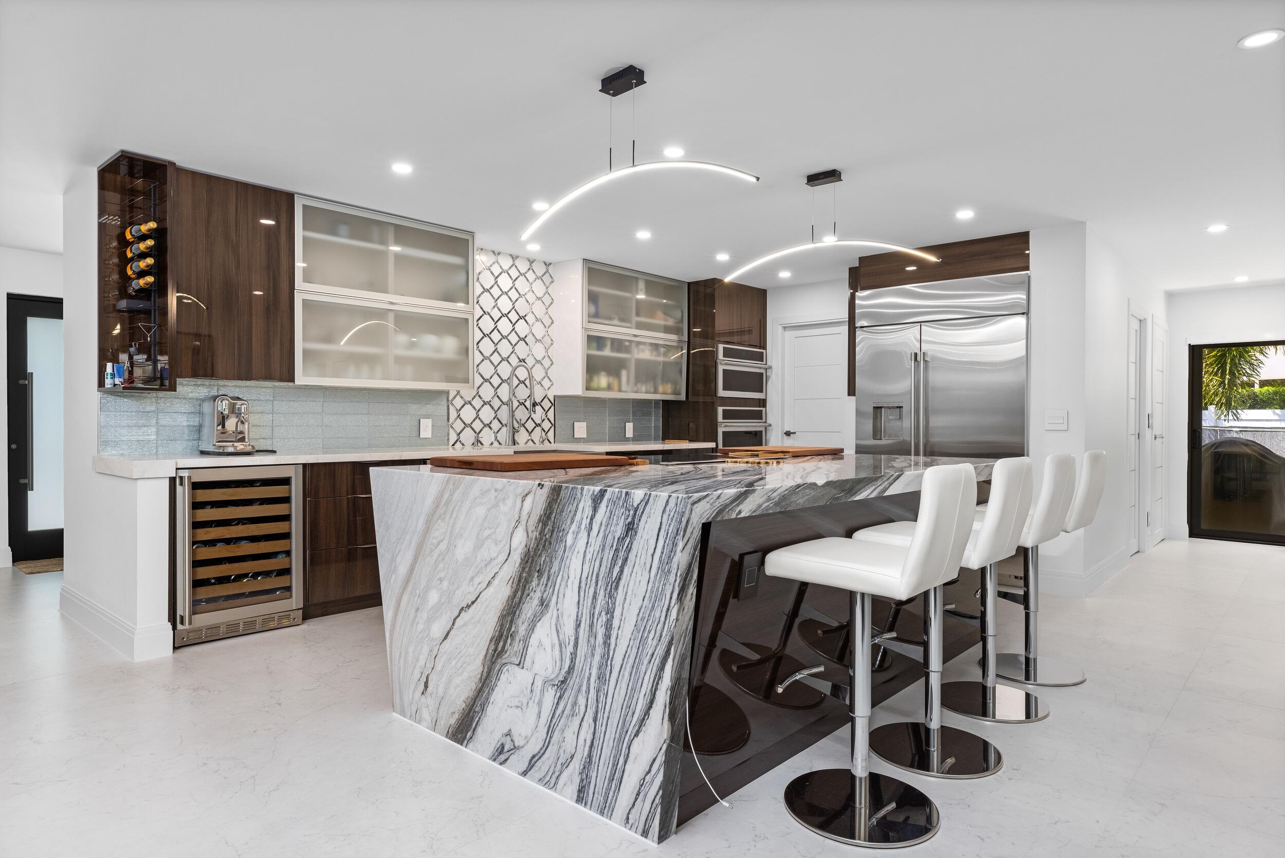 843 Northeast Mulberry Drive Boca Raton, FL 33487 - Photo 13 of 57 a large kitchen with a table and chairs