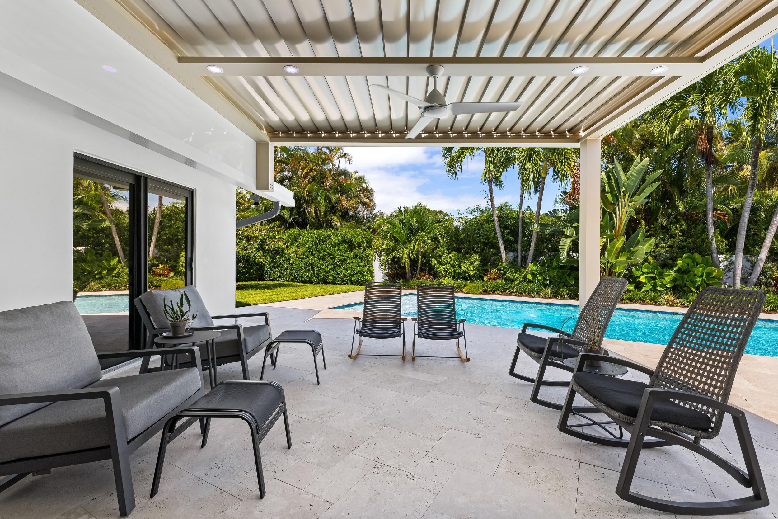 843 Northeast Mulberry Drive Boca Raton, FL 33487 - Photo 20 of 57 a view of a patio with chairs and table in patio