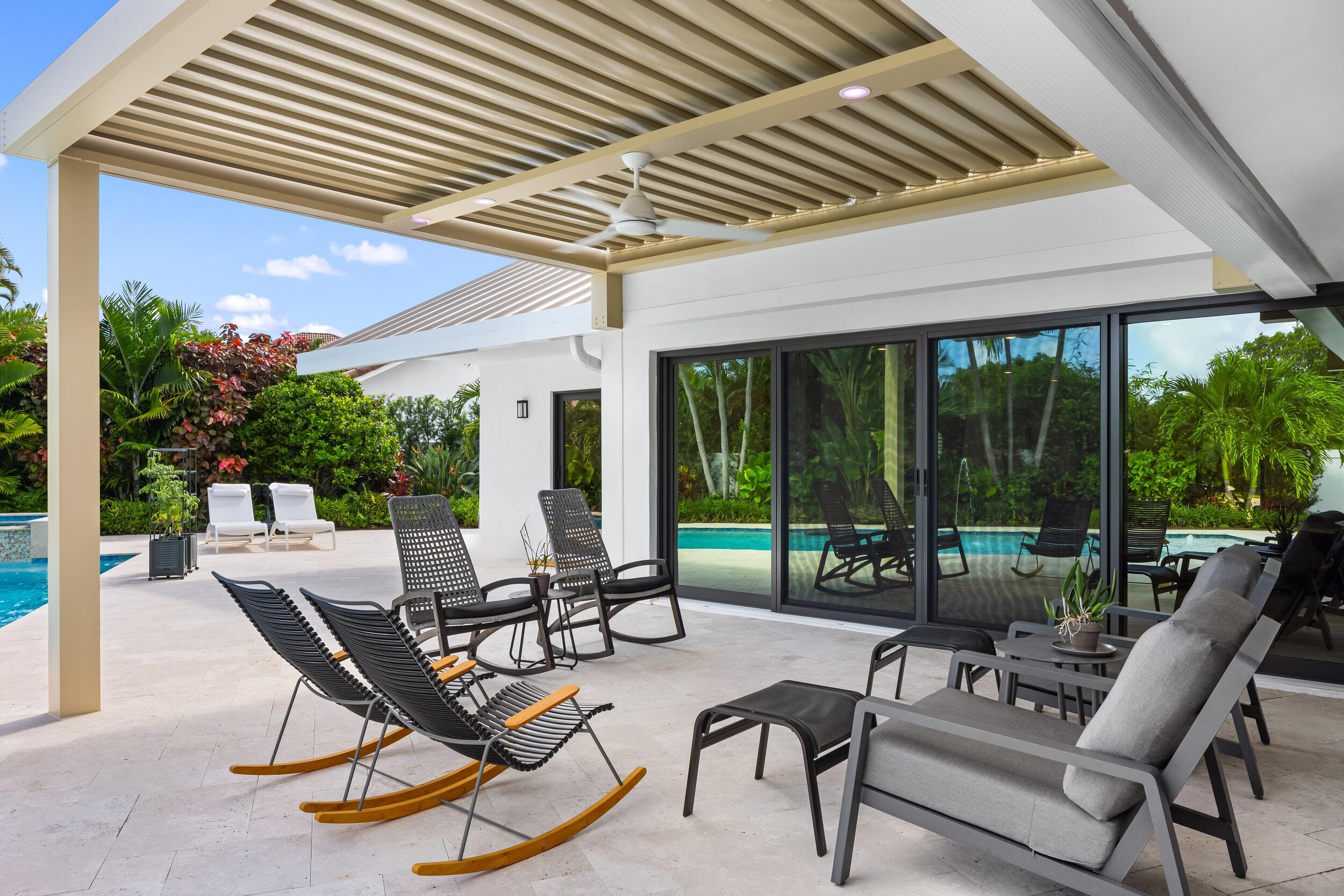 843 Northeast Mulberry Drive Boca Raton, FL 33487 - Photo 21 of 57 a building outdoor space with patio furniture and garden