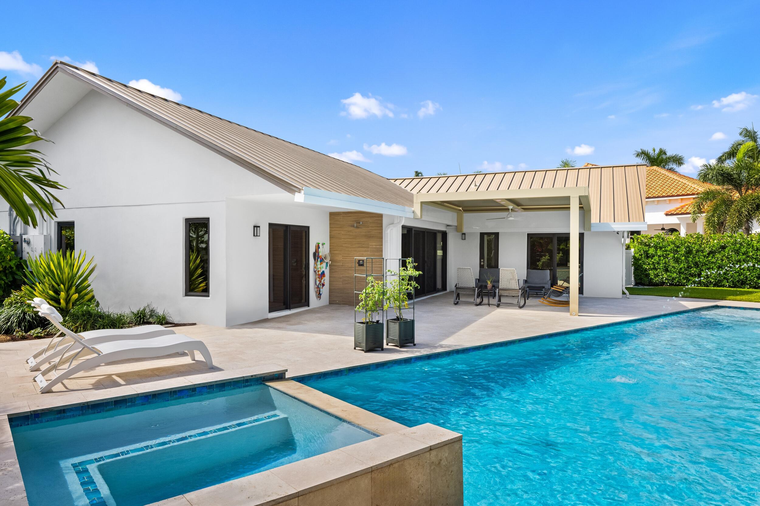 843 Northeast Mulberry Drive Boca Raton, FL 33487 - Photo 3 of 57 a view of a house with backyard and sitting area