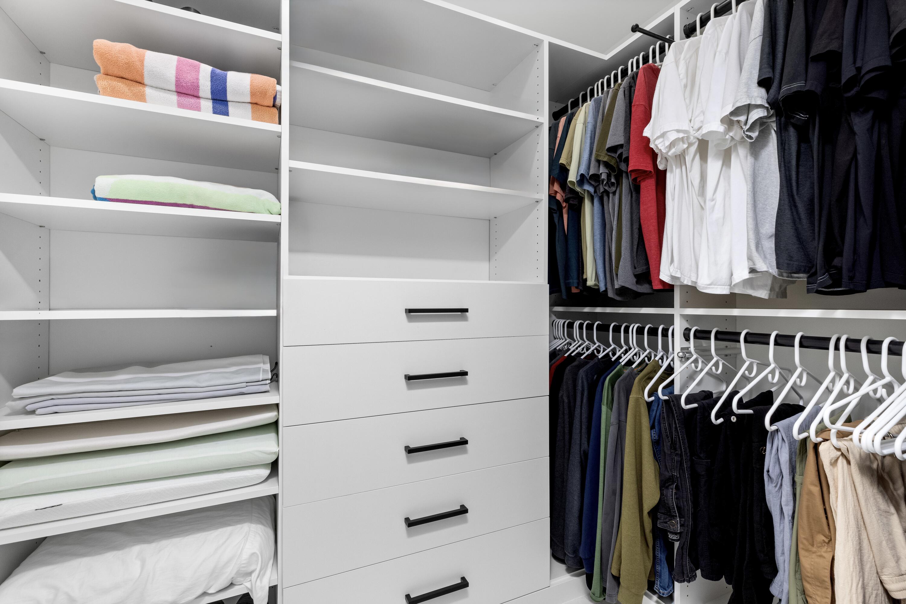 843 Northeast Mulberry Drive Boca Raton, FL 33487 - Photo 31 of 57 a view of walk in closet with clothes and shoes