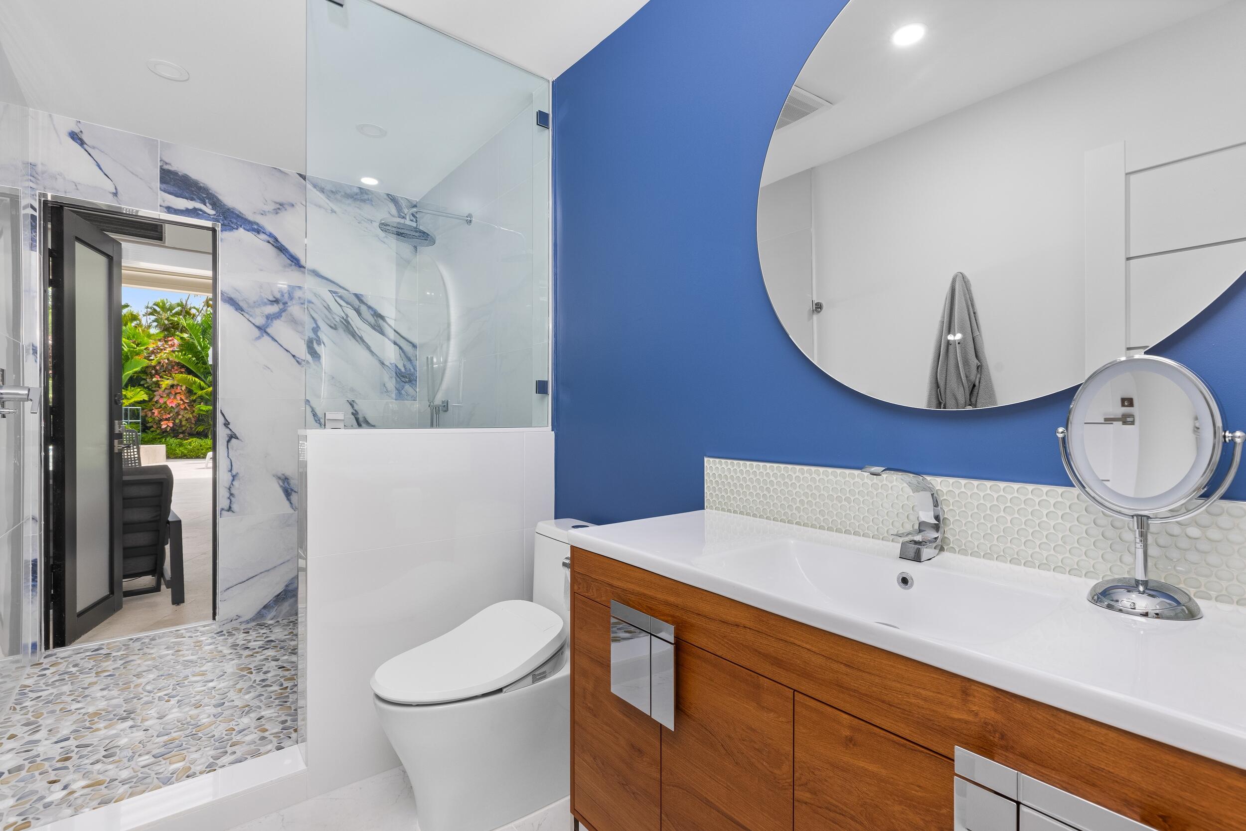 843 Northeast Mulberry Drive Boca Raton, FL 33487 - Photo 33 of 57 a bathroom with a sink a toilet and a mirror