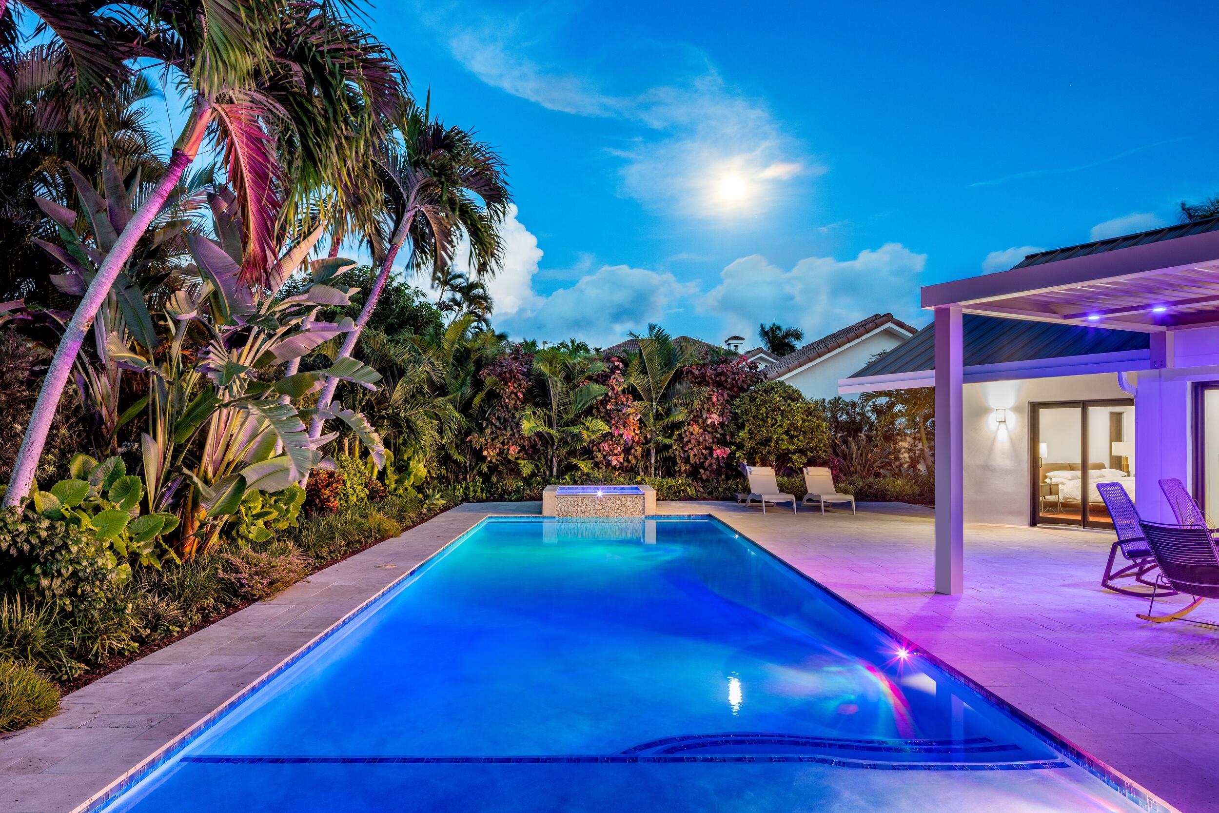 843 Northeast Mulberry Drive Boca Raton, FL 33487 - Photo 41 of 57 a room with lots of flowers