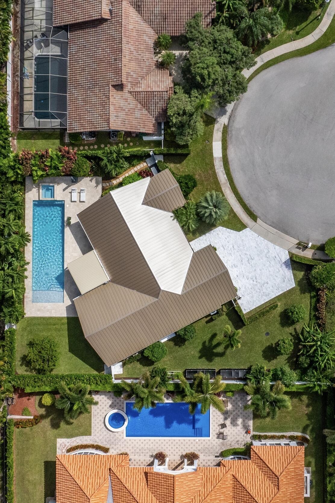 843 Northeast Mulberry Drive Boca Raton, FL 33487 - Photo 56 of 57 an aerial view of a house with yard swimming pool and outdoor seating