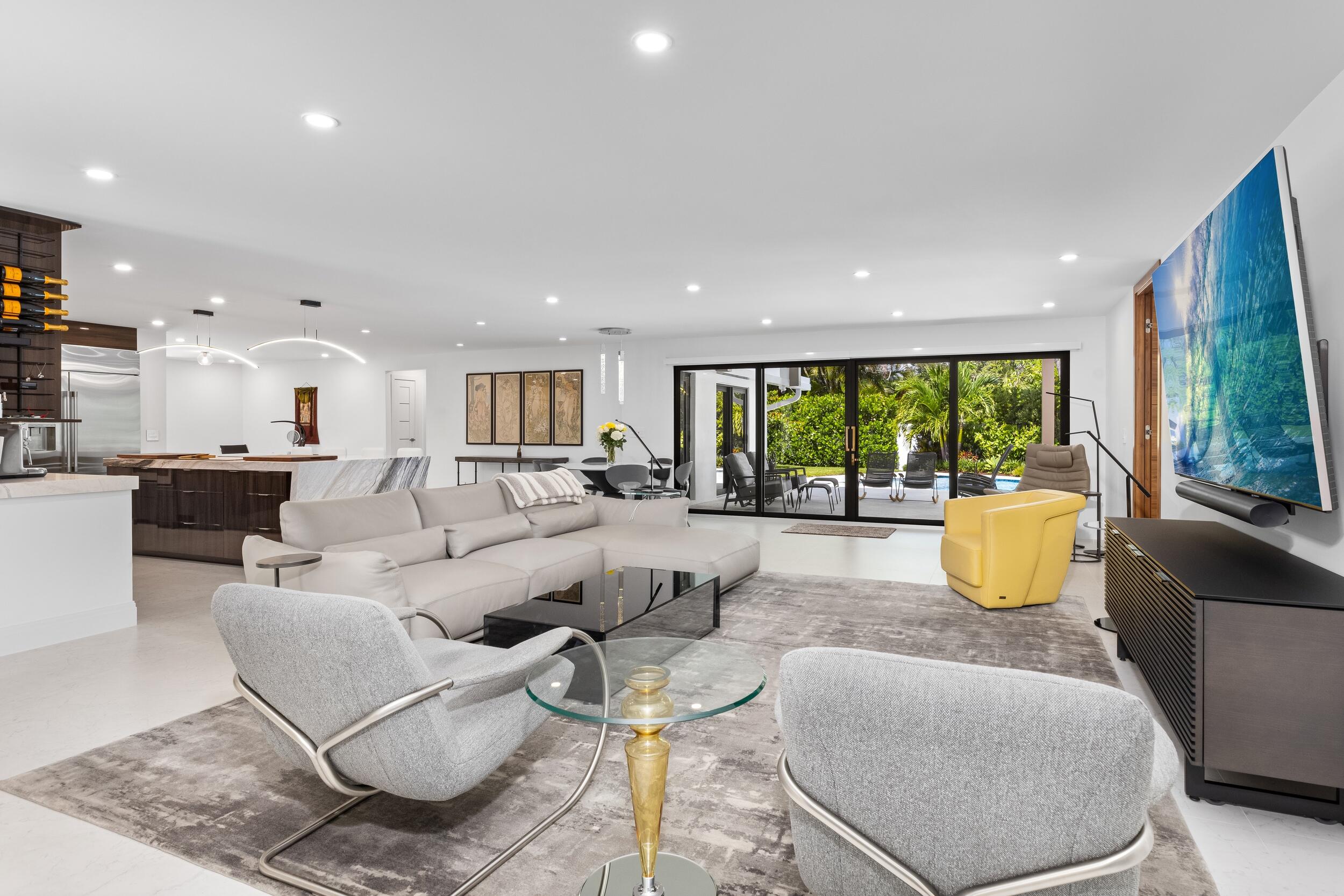 843 Northeast Mulberry Drive Boca Raton, FL 33487 - Photo 8 of 57 a living room with fireplace furniture and a large window