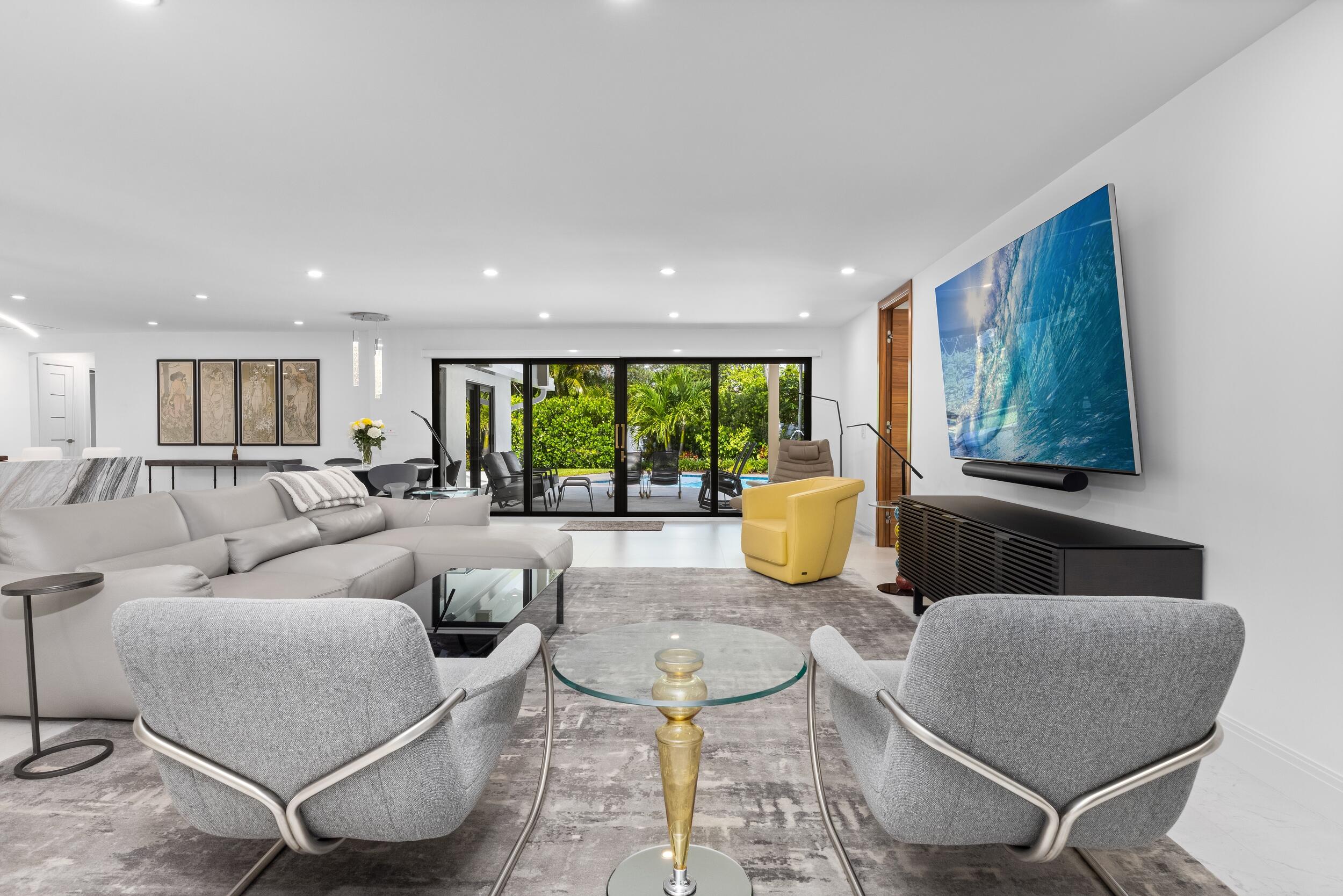 843 Northeast Mulberry Drive Boca Raton, FL 33487 - Photo 9 of 57 a living room with furniture and a large window